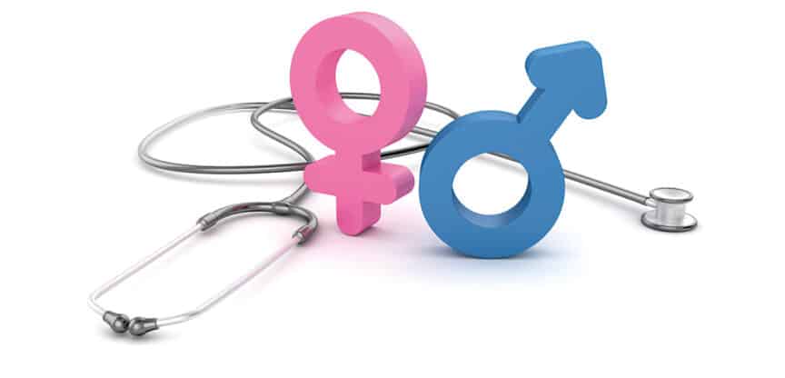 Rosa weibliches und blaues männliches Symbol neben einem Stethoskop auf weißem Hintergrund.